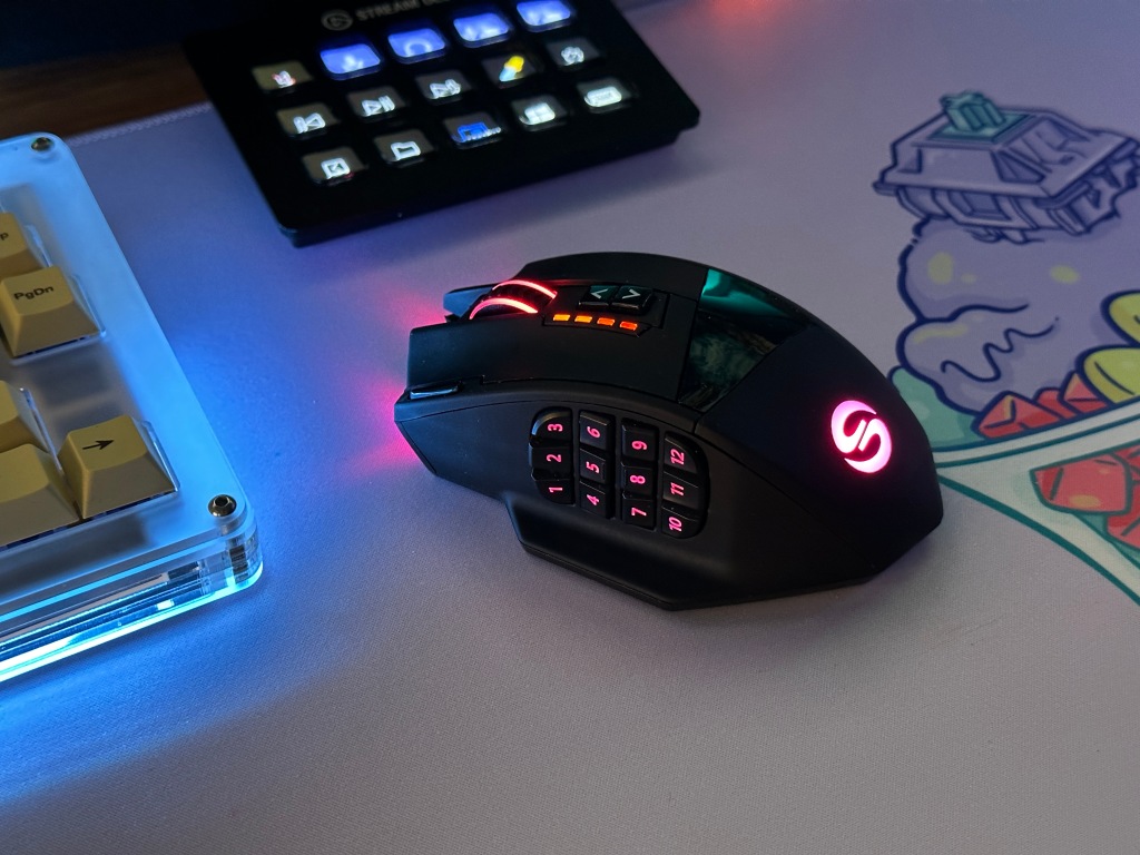 Angled view of UtechSmart Venus Pro mouse at desk setup during night